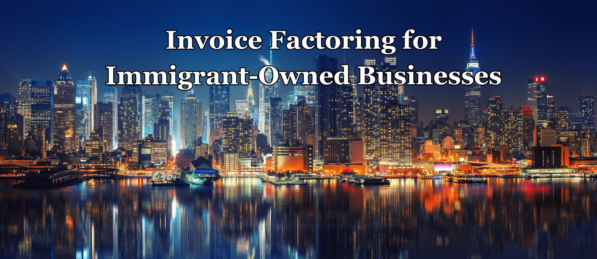 City skyline at night with colorful reflections on the water.